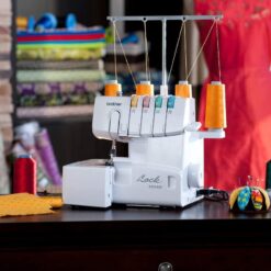 Alternative view of 1034D Serger. Heavy-Duty Metal Frame Overlock Machine. 1.300 Stitches Per Minute. Removeable Trim Trap. 3 Included Accessory Feet