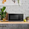 Mainstays 0.7 cu. ft. Countertop Microwave Oven, 700 Watts, White, New - Image 9